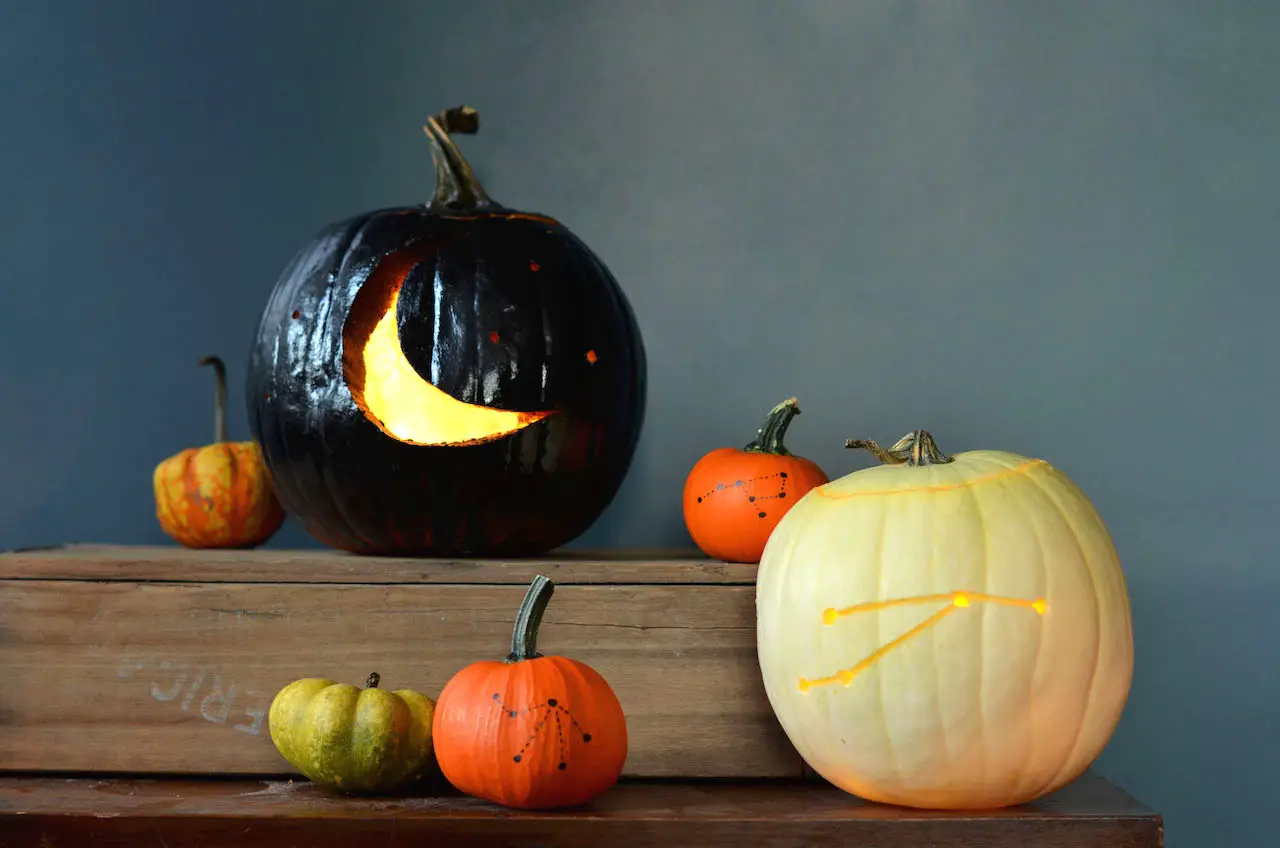 Pumpkins carved with moons and stars