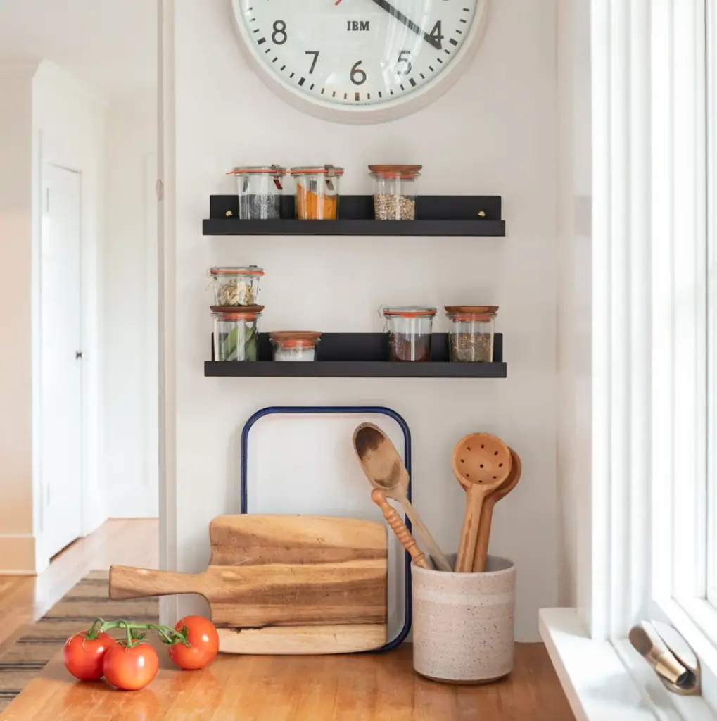 how to style a picture ledge shelf in the kitchen

